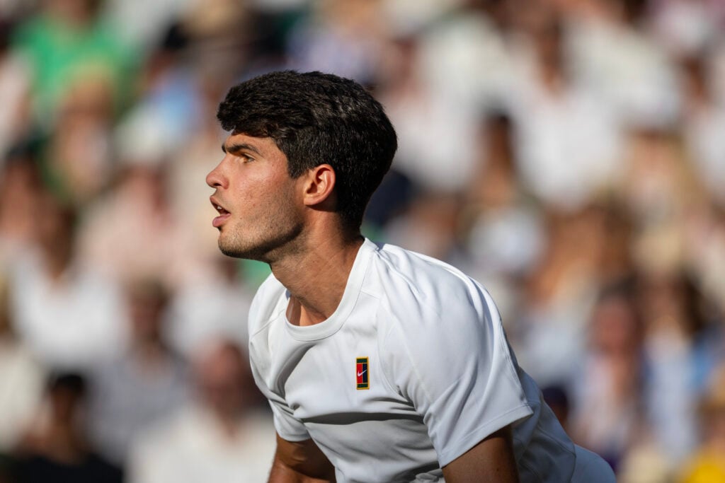 Carlos Alcaraz in action during the 2025 Wimbledon Championships.