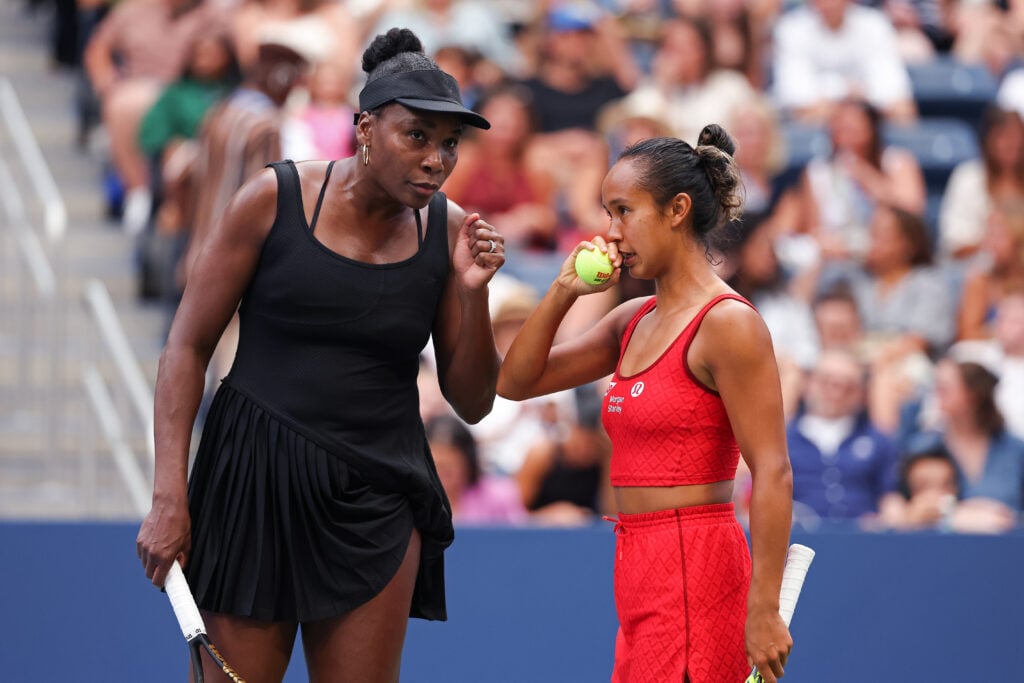Venus Williams of the United States and Leylah Fernandez of Canada talk during their Women's Doubles Quarterfinal match against Katerina Siniakova of Czechia and Taylor Townsend of the United States on Day Ten of the 2025 US Open at USTA Billie Jean King National Tennis Center on September 2, 2025 in the Flushing neighborhood of the Queens borough of New York City.
