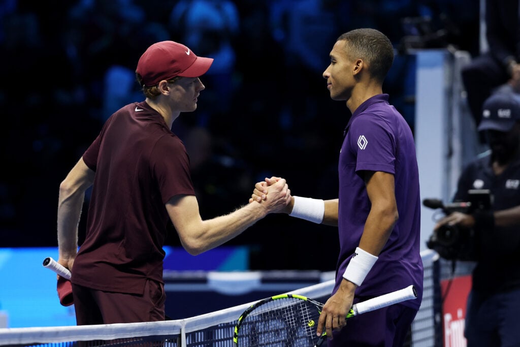 Jannik Sinner of Italy shakes hands with Felix Auger Aliassime of Canada after the Group Stage match on day two of the Nitto ATP Finals 2025 at Inalpi Arena on November 10, 2025 in Turin, Italy.