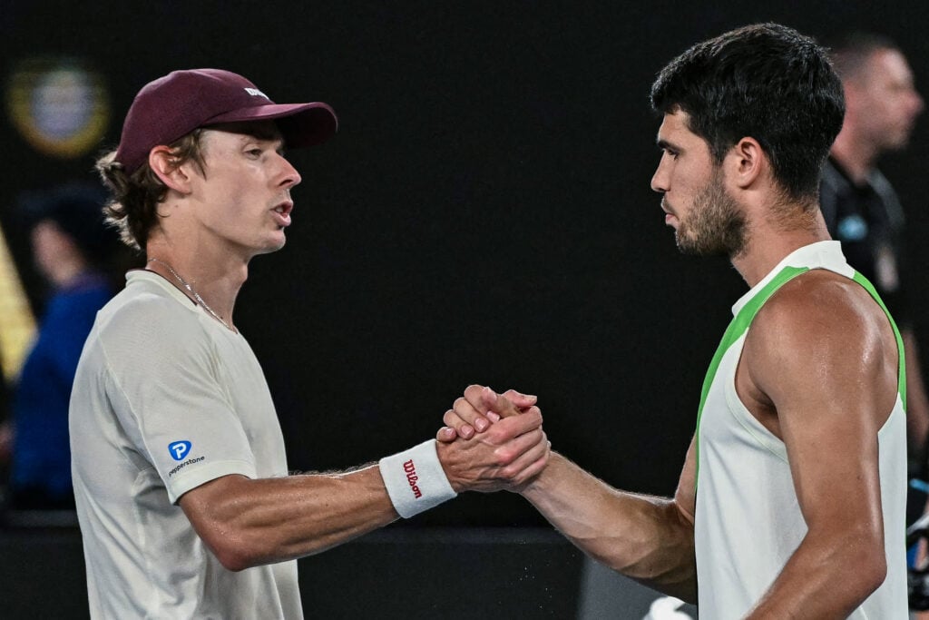 Carlos Alcaraz and Alex de Minaur embrace after their match at the 2026 Australian Open