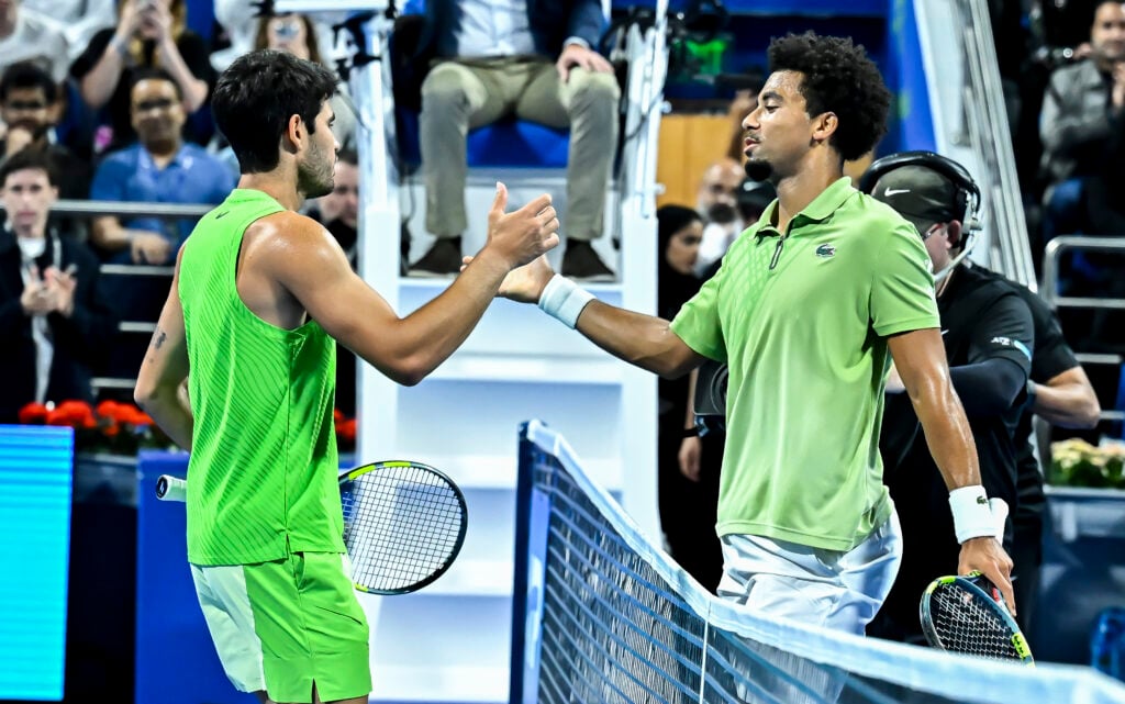 Carlos Alcaraz of Spain shakes hand with Arthur Fils of
