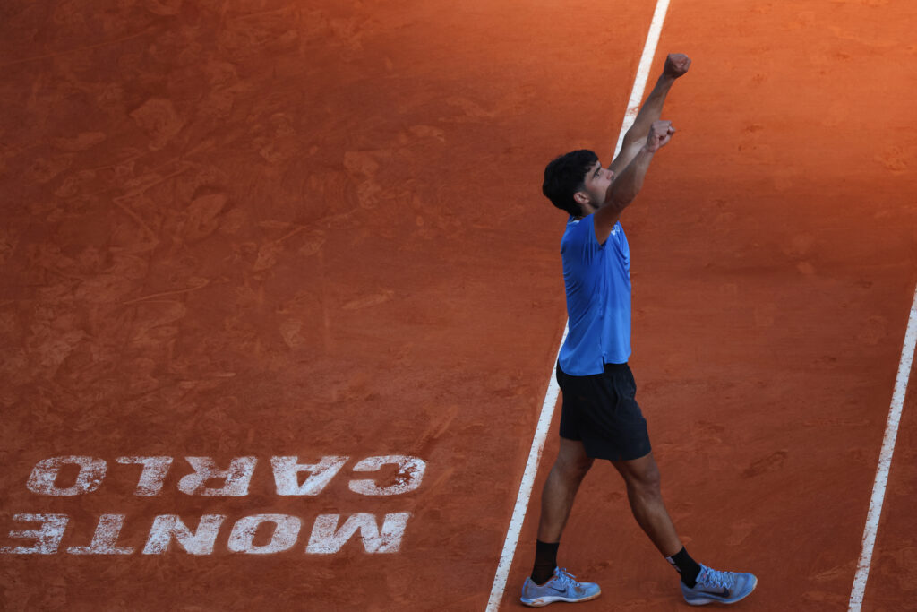 Spain's Carlos Alcaraz celebrates his victory over Argentina's Tomas Martin Etcheverry at the end of their their Monte Carlo ATP Masters Series Tournament round of 16 tennis match on Court Rainier III at the Monte-Carlo Country Club in Roquebrune-Cap-Martin, south-eastern France on April 9, 2026.