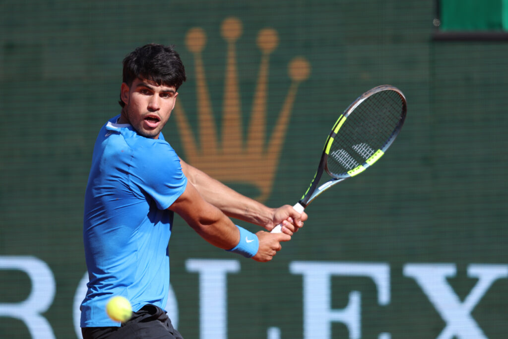 Carlos Alcaraz of Spain plays a backhand during his Round of 16 match against Tomas Etcheverry of Argentina on day Five of the Rolex Monte-Carlo Masters at Monte-Carlo Country Club on April 9, 2025 in Monte-Carlo, Monaco.