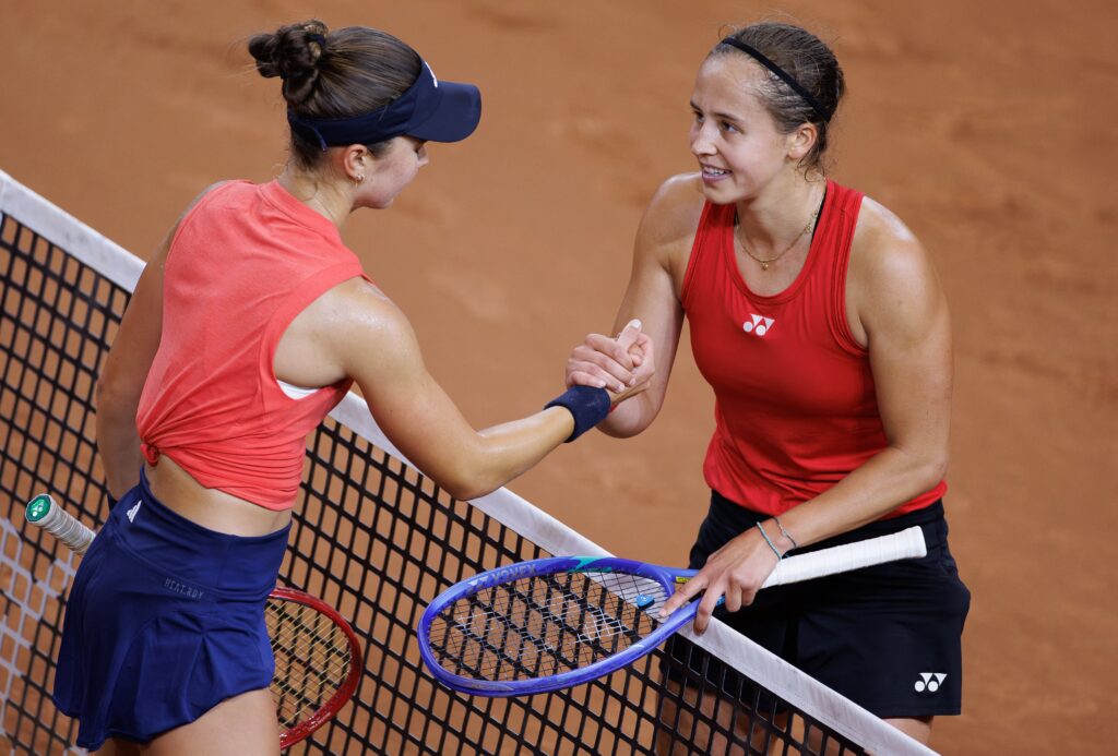 Iva Jovic shakes hands with Hanne Vandewinkel after losing to her in the Billie Jean King Cup.