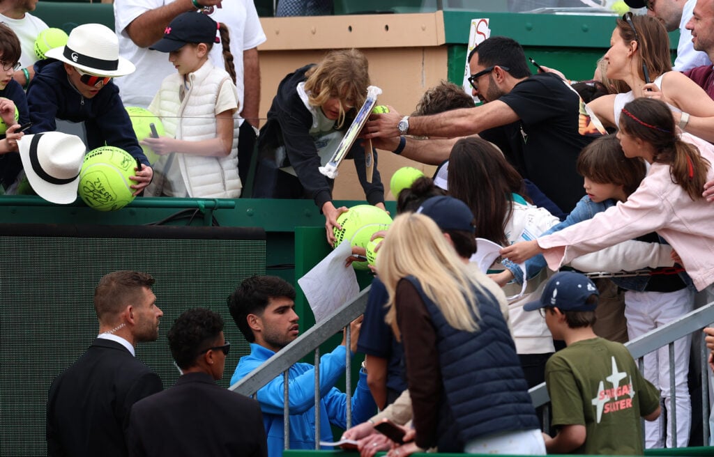 Carlos Alcaraz of Spain signs autographs after his match against Alexander Bublik of Kazakhstan during the Men's Singles Quarter Final match on day six of the Rolex Monte-Carlo Masters at Monte-Carlo Country Club on April 10, 2026 in Monte-Carlo, Monaco.