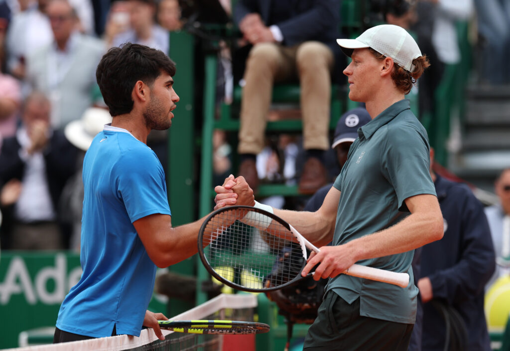 Jannik Sinner of Italy shakes hands with Carlos Alcaraz of Spain after victory in the Men's Singles Final during day eight of the Rolex Monte-Carlo Masters at Monte-Carlo Country Club on April 12, 2026 in Monte-Carlo, Monaco.