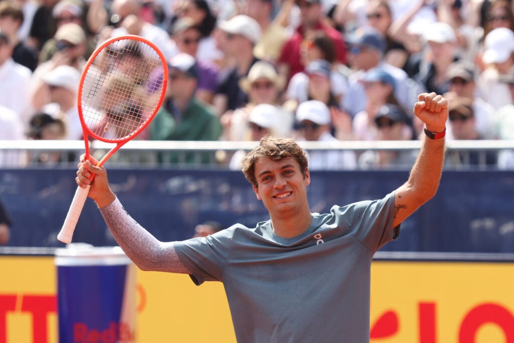 Flavio Cobolli of Italy celebrates after winning his semi-final match against Alexander Zverev of Germany during day eight of the BMW Open at MTTC IPHITOS on April 18, 2026 in Munich, Germany.