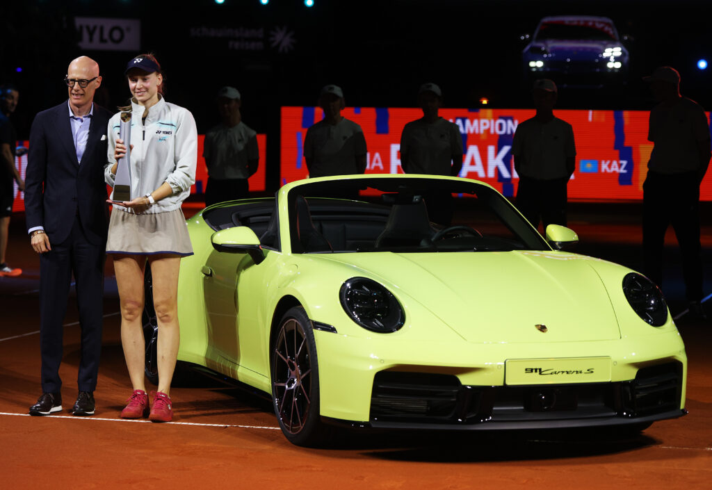 Elena Rybakina of Kazakhstan celebrates with the trophy and her new 911 after victory over Karolina Muchova of Czechia in the final on day six of the Porsche Tennis Grand Prix 2026 at Porsche Arena on April 18, 2026 in Stuttgart, Germany.