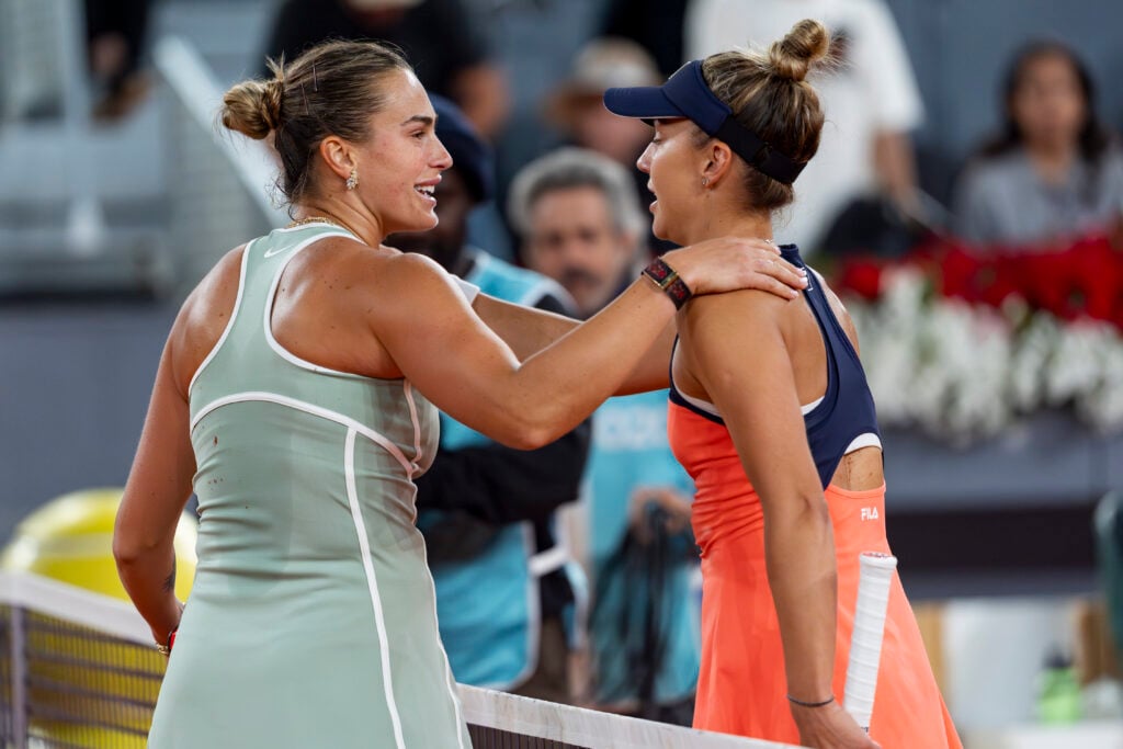 Aryna Sabalenka (L) greets Jaqueline Cristian of Romania (R) at the end of the Women's Singles Round of 32 match during the Mutua Madrid Open 2026 tournament celebrated at La Caja Magica on April 25, 2026 in Madrid, Spain.