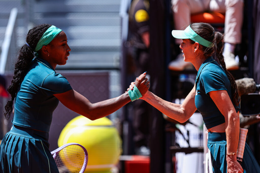 Coco Gauff of the United States shakes hands with Sorana Cirstea of Romania during their Women's Singles match on Day Seven of the Mutua Madrid Open at La Caja Magica on April 26, 2026, in Madrid, Spain.
