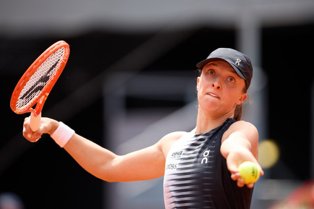 Iga Swiatek of Poland serves against Daria Snigur of Ukraine during the Women’s Singles Second Round match at Manolo Santana Stadium on day four of the Mutua Madrid Open at La Caja Magica on April 23, 2026 in Madrid, Spain.