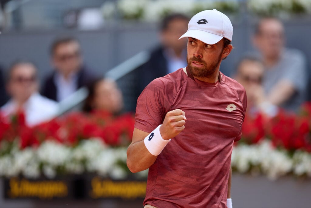 Benjamin Bonzi celebrates against Jannik Sinner in Madrid
