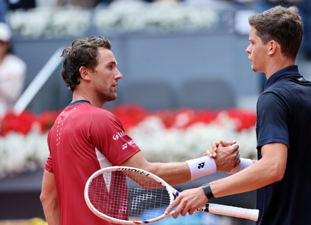 Belgium's Alexander Blockx shakes hands with Norway's Casper Ruud after beating him during their 2026 ATP Tour Madrid Open tennis tournament quarter-final singles match at the Caja Magica in Madrid, on April 30, 2026.