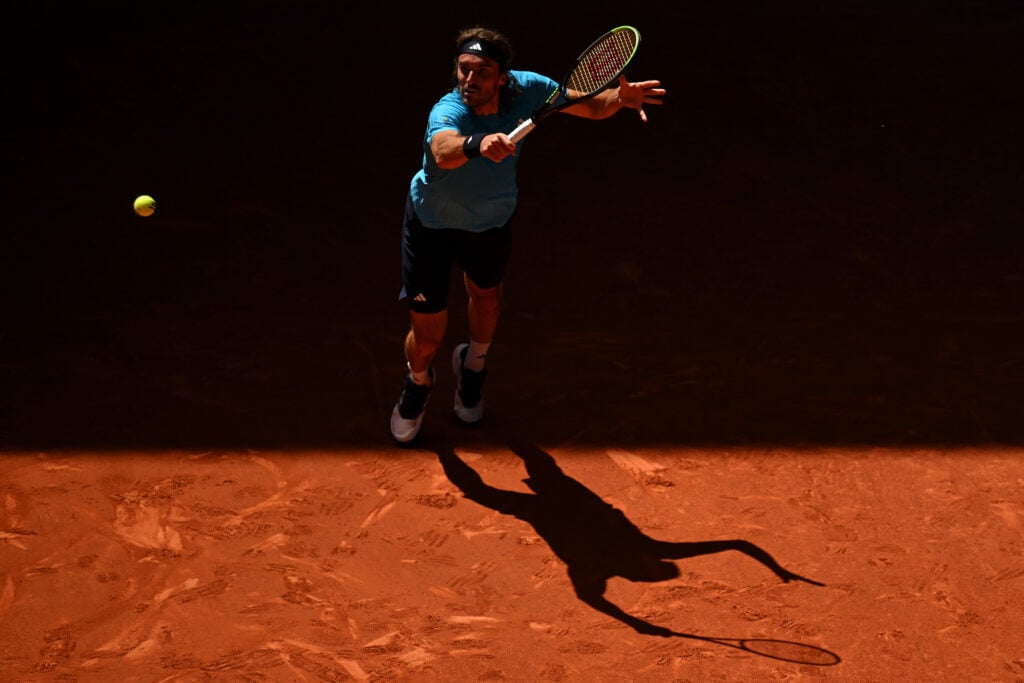 Stefanos Tsitsipas of Greece plays a backhand against Daniel Merida of Spain during their match on Day 8 of the Mutua Madrid Open at La Caja Magica on April 27, 2026 in Madrid, Spain.