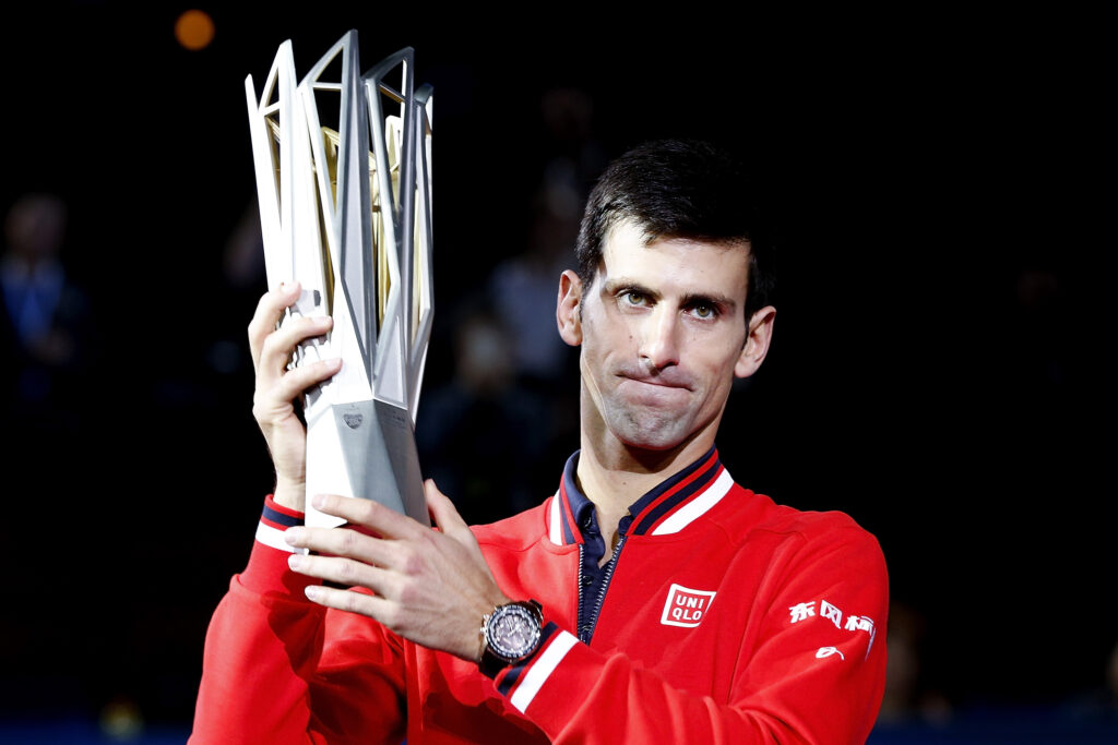 Novak Djokovic of Serbia poses with the winner's trophy after defeating Jo-Wilfried Tsonga of France during the men's singles final match of the Shanghai Rolex Masters at the Qi Zhong Tennis Center on day 8 of Shanghai Rolex Masters at Qi Zhong Tennis Centre on October 18, 2015 in Shanghai, China.