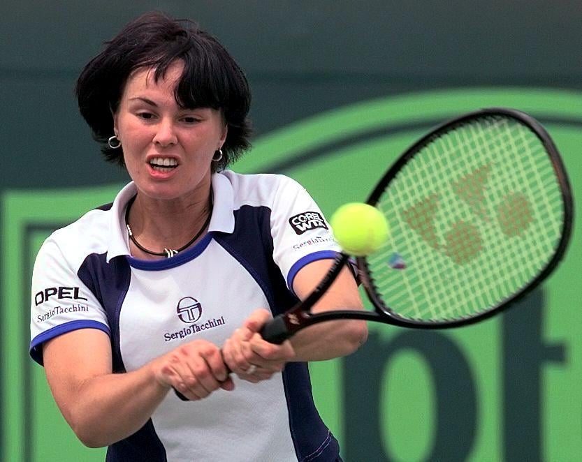Number 1 seed Martina Hingis of Switzerland returns a shot to Joannette Kruger of South Africa 22 March at the Lipton Championship in Key Biscayne, FL. Hingis won in straight sets 6-0, 6-0.