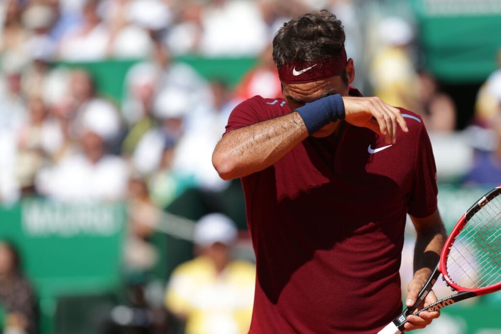 Switzerland's Roger Federer reacts during his tennis match against France's Jo Wilfried Tsonga at the Monte-Carlo ATP Masters Series tournament , on April 15, 2016 in Monaco.