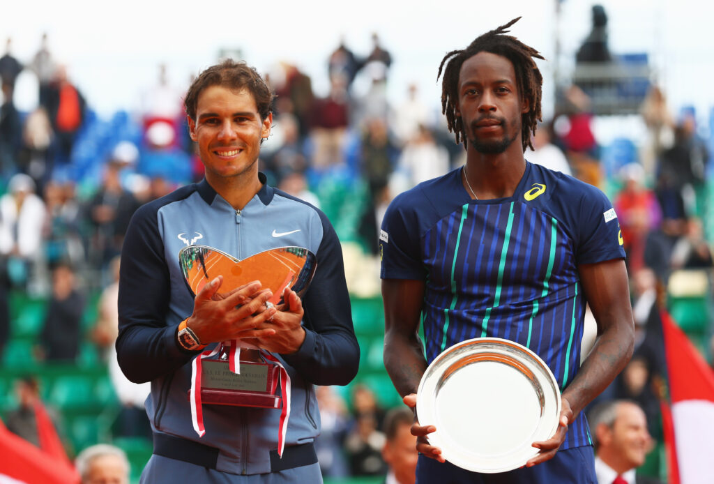 Winner Rafael Nadal of Spain poses with the trophy alongside runner-up Gael Monfils of France after the singles final match during day eight of the Monte Carlo Rolex Masters at Monte-Carlo Sporting Club on April 17, 2016 in Monte-Carlo, Monaco.