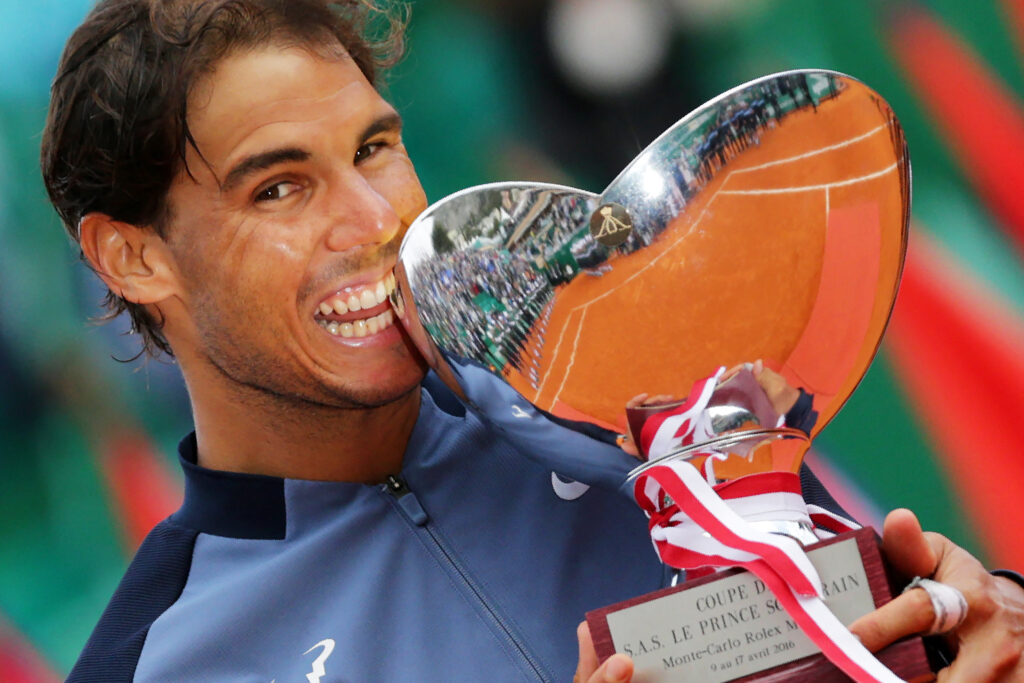 Spain's Rafael Nadal holds his trophy during the awarding ceremony following the final tennis match against France's Gael Monfils at the Monte-Carlo ATP Masters Series Tournament in Monaco on April 17, 2016. Nadal defeated Monfils 7-5, 5-7, 6-0 to win a record ninth title at the Monte Carlo Masters.