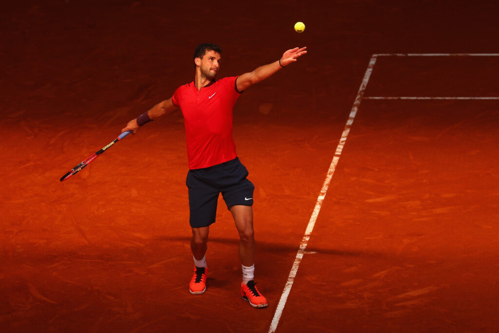 Grigor Dimitrov of Bulgaria in action against Pablo Carreno Busta of Spain during day four of the Mutua Madrid Open tennis tournament at the Caja Magica on May 03, 2016 in Madrid, Spain.