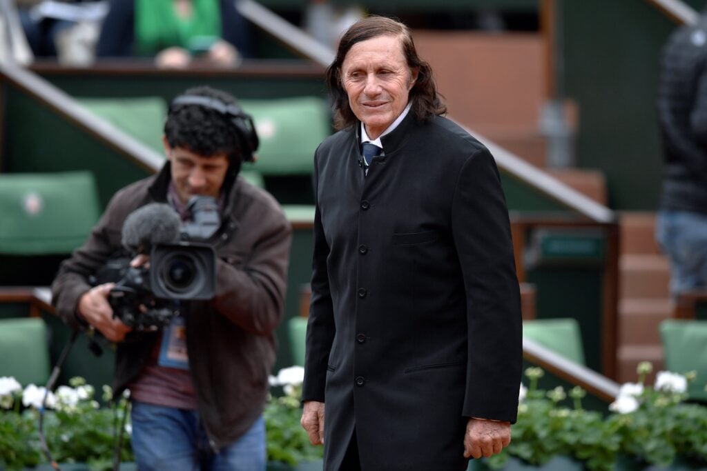 Argentinian former tennis player Guillermo Vilas arrives for a ceremony to induct former French tennis player Amelie Mauresmo into the International Tennis Hall of Fame before the women's final match at the Roland Garros 2016 French Tennis Open in Paris on June 4, 2016.