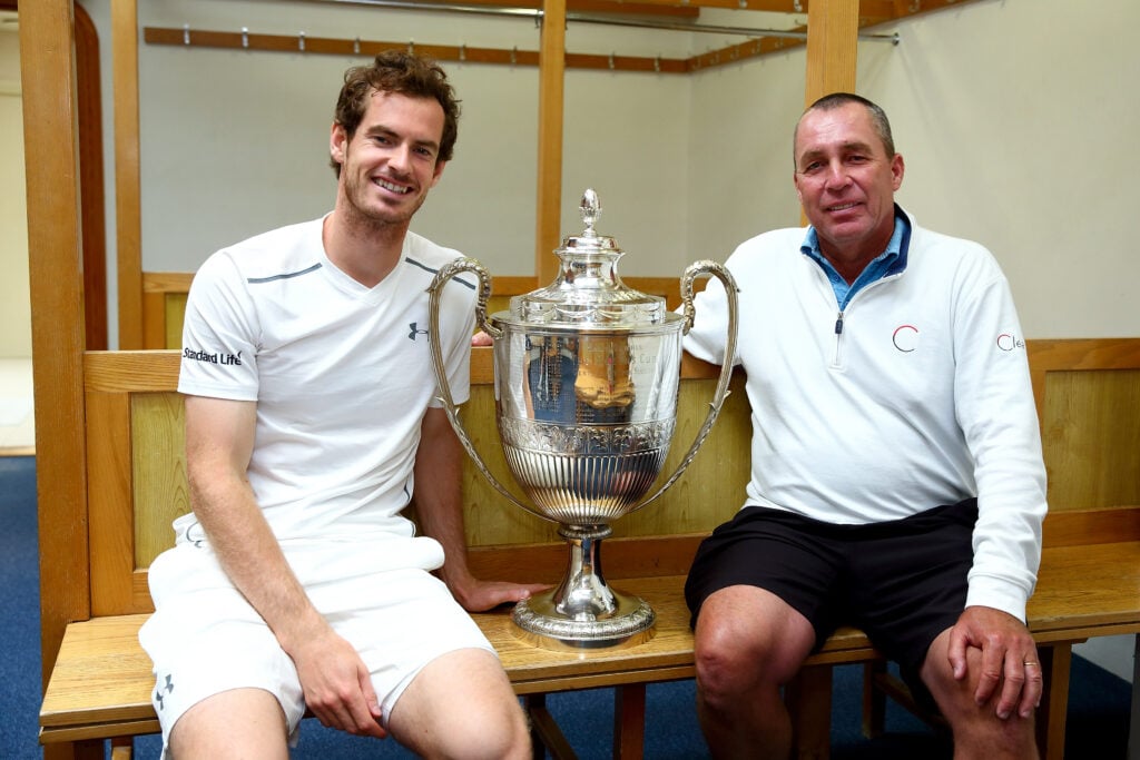 Andy Murray of Great Britain (L) and his coach Ivan Lendl (R) pose with the Aegon Championships trophy after winning his record breaking fifth title with victory in his final match against Milos Raonic of Canada during day seven of the Aegon Championships at the Queens Club on June 19, 2016 in London, England.