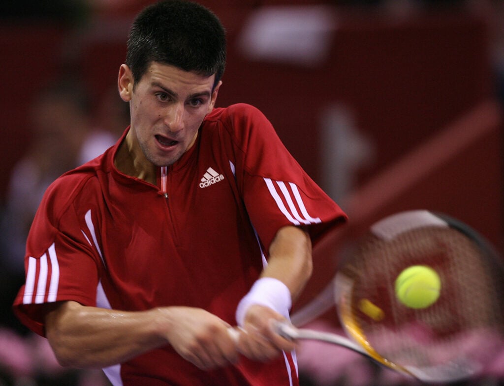 Serbian Novak Djokovic returns a ball to Briton Andy Murray during their tennis masters match at Rockodromo Arena in Madrid, 19 October 2006.