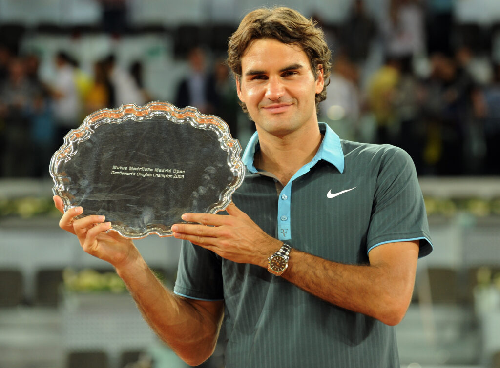 Roger Federer of Switzerland holds aloft the winners trophy after his straight set victory against Rafael Nadal of Spain during the final of the Madrid Open tennis tournament at the Caja Magica on May 17, 2009 in Madrid, Spain. Federer won the match in two sets, 6-4 and 6-4.
