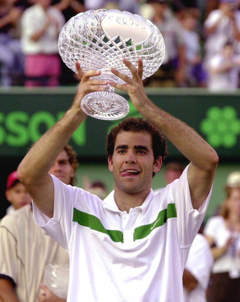 Pete Sampras of the US holds the Ericsson Open first place trophy after defeating Gustavo Kuerten of Brazil in the Men's Finals of the Ericsson Open tennis tournament in Key Biscayne, 02 April 2000. Sampras defeated Kuerten 6-1, 6-7 (2/7), 7-6 (7/5), 7-6 (10-8).