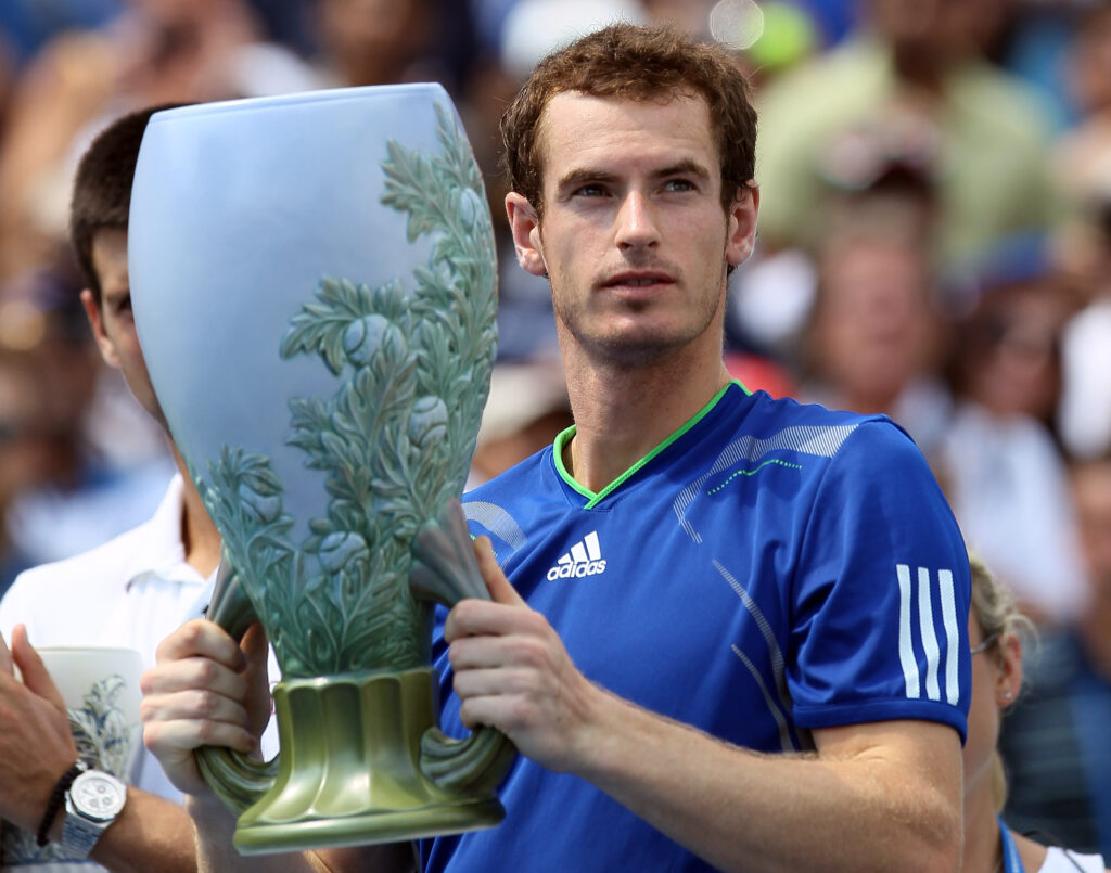 Andy Murray of Great Britain holds up his championship trophy after he defeated Novak Djokovic of Serbia during the Western & Southern Open at the Lindner Family Tennis Center on August 21, 2011 in Mason, Ohio. Murray won the match after Djokovic retired due to injury in the second set.