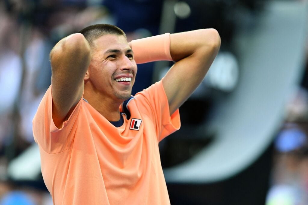Australia's Alexei Popyrin celebrates after beating Taylor Fritz of the US during their men's singles match on day four of the Australian Open tennis tournament in Melbourne on January 19, 2023.