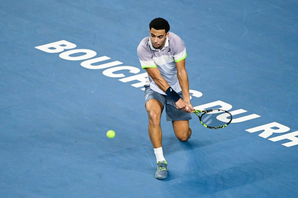 France's Arthur Fils hits a return to Frances Benjamin Bonzi during the men's semi final of the ATP tennis Open 13 in Marseille, southern France on February 25, 2023.