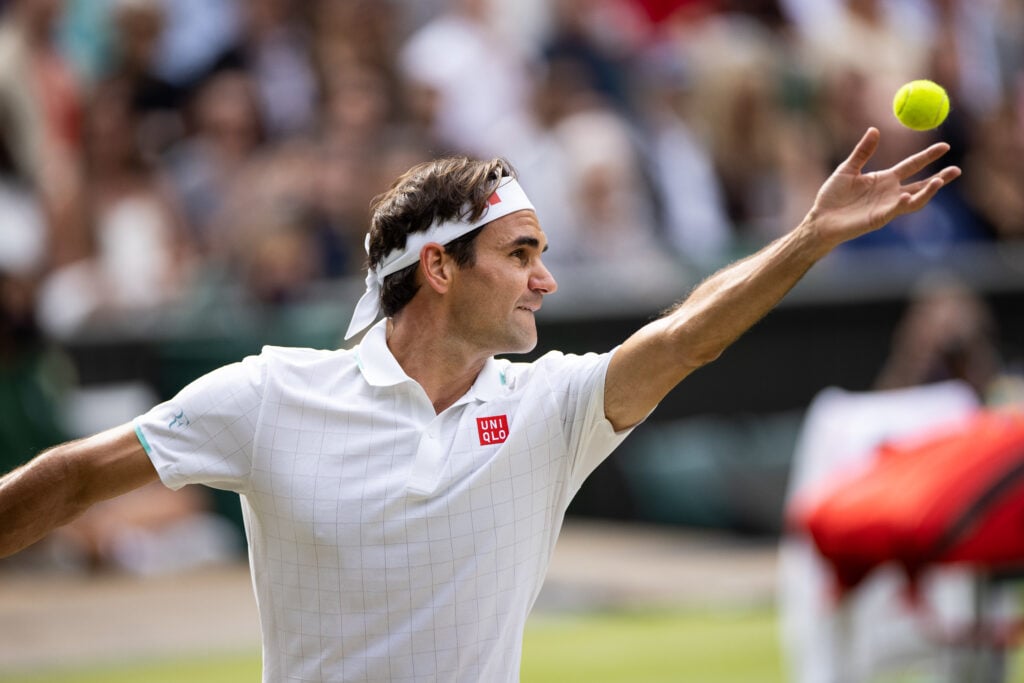 Roger Federer serves during Wimbledon in 2021