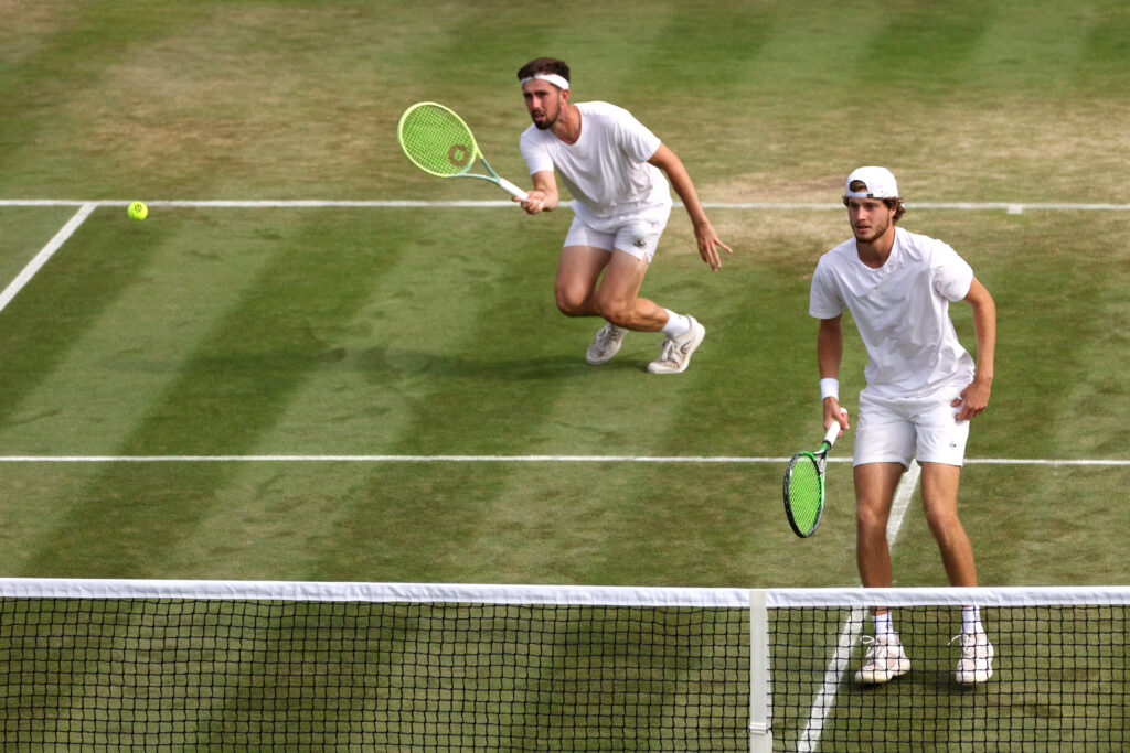 Toby Samuel of Great Britain and Connor Thomson (L) of Great Britain compete against Santiago Gonzalez of Mexico and Edouard Roger-Vasselin of France in the Men's Doubles Second Round match during day eight of The Championships Wimbledon 2023 at All England Lawn Tennis and Croquet Club on July 10, 2023 in London, England.