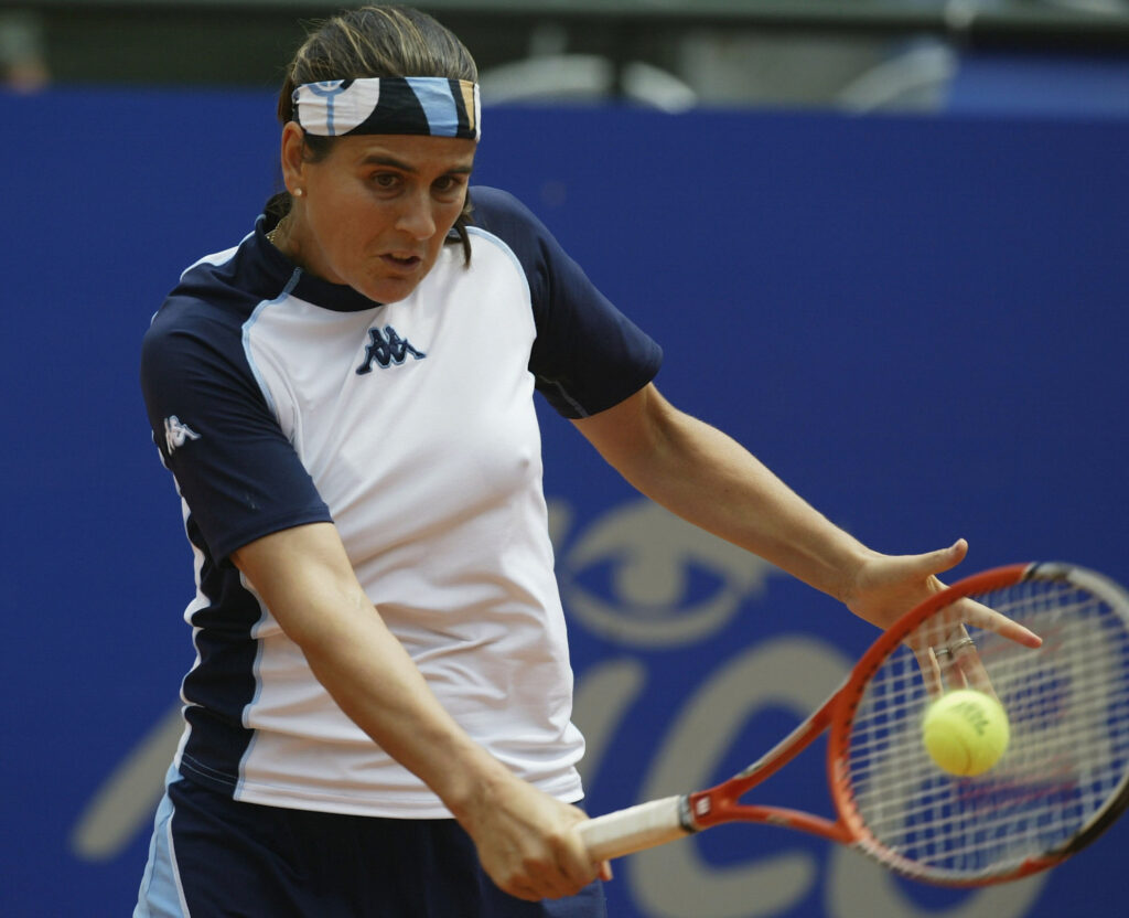Conchita Martinez of Spain hits a backhand return during her third round match against Daniela Hantuchova of Slovakia in the WTA Telecom Italia Masters tournament held at the Foro Italico on May 15, 2003 in Rome, Italy.