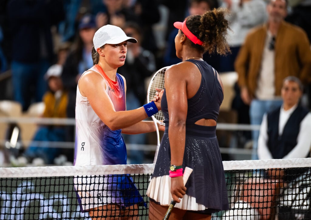 Iga Swiatek and Naomi Osaka shake hands after their match at the 2024 French Open