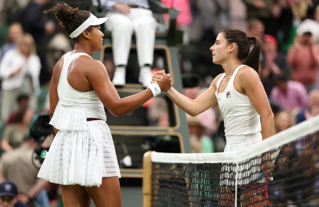 Naomi Osaka of Japan meets Emma Navarro of United States at the net following defeat in her Women's Singles second round match during day three of The Championships Wimbledon 2024 at All England Lawn Tennis and Croquet Club on July 03, 2024 in London, England.