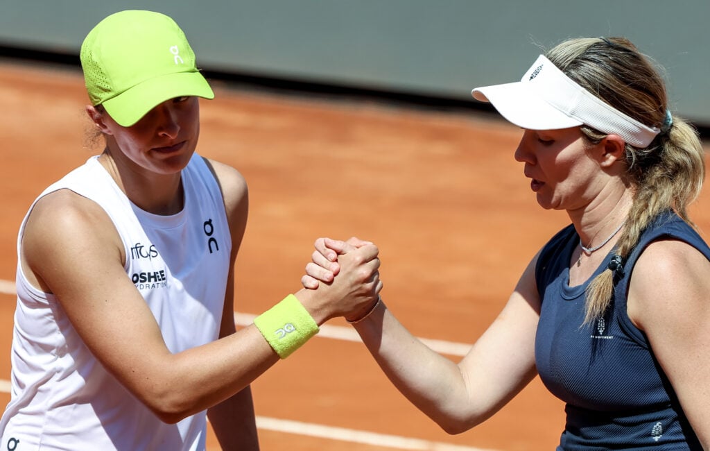 Iga Swiatek and Danielle Collins embrace after their Italian Open match in 2025