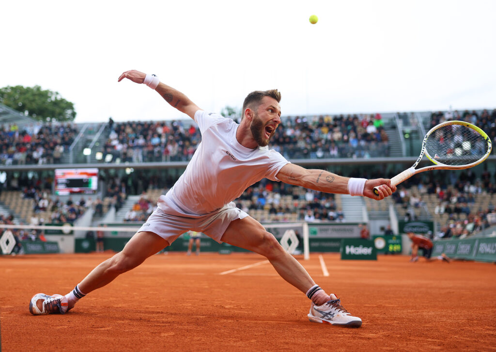 Corentin Moutet reaches for the ball during the 2025 French Open