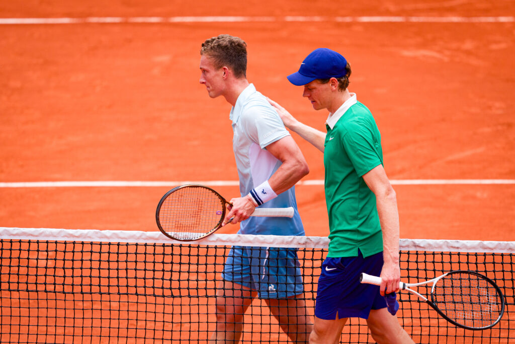 Jannik Sinner (R) of Italy comes to the net to greet Jiri Lehecka of Czechia after victory during the Men's Singles Third Round match on Day Seven of the 2025 French Open at Roland Garros on May 31, 2025 in Paris, France.