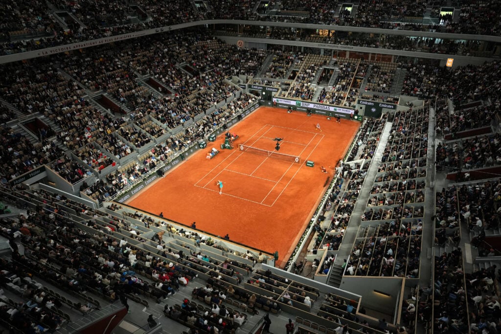Spectators watch Poland's Iga Swiatek (R) and Belarus' Aryna Sabalenka's women's singles semi-final match on day 12 of the French Open tennis tournament on Court Philippe-Chatrier at the Roland-Garros Complex in Paris on June 5, 2025.