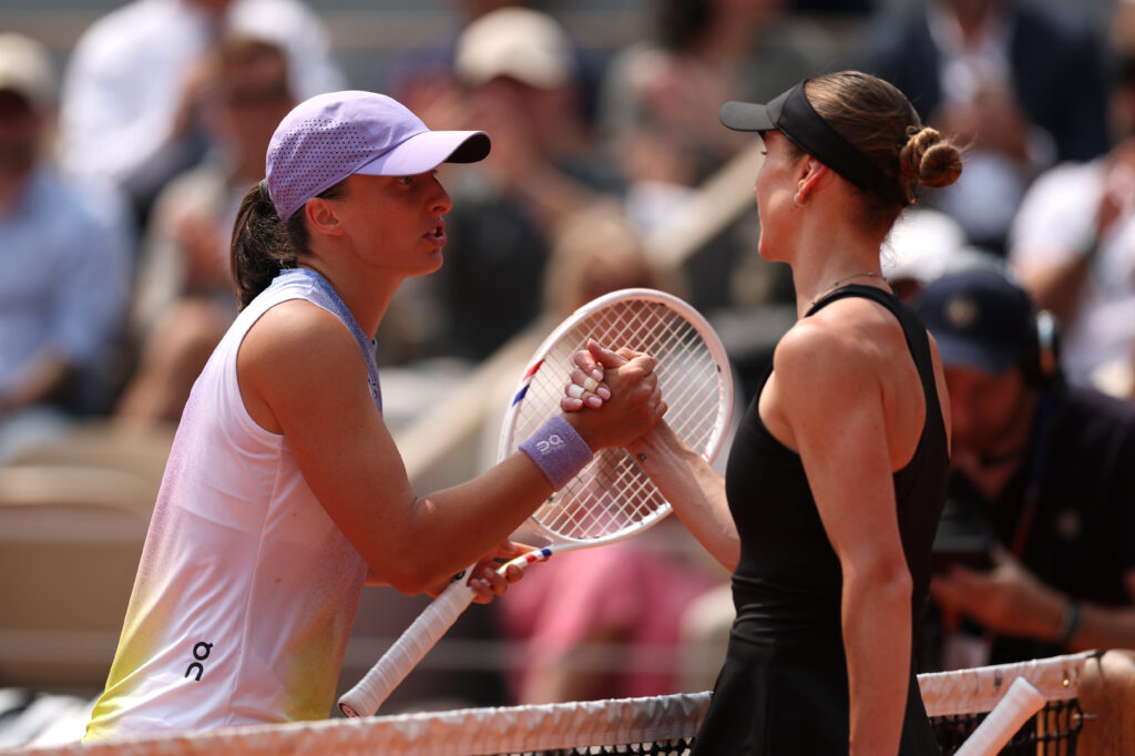 Iga Swiatek of Poland greets Elina Svitolina of Ukraine at the net after her victory in the Women's Singles Quarter Final match on Day Ten of the 2025 French Open at Roland Garros on June 03, 2025 in Paris, France.