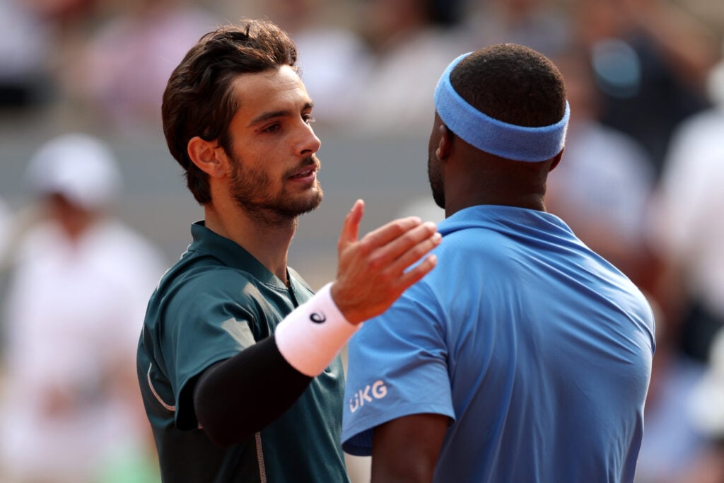 Lorenzo Musetti of Italy greets Frances Tiafoe of United States at the net after his victory in the Men's Singles Quarter Final match on Day Ten of the 2025 French Open at Roland Garros on June 03, 2025 in Paris, France.