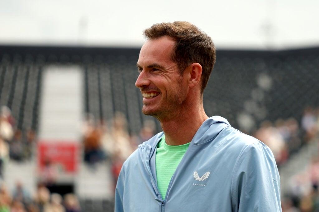 Andy Murray smiles during the Andy Murray Arena unveiling on Day One of the 2025 HSBC Championships at The Queen's Club on June 09, 2025 in London, England.