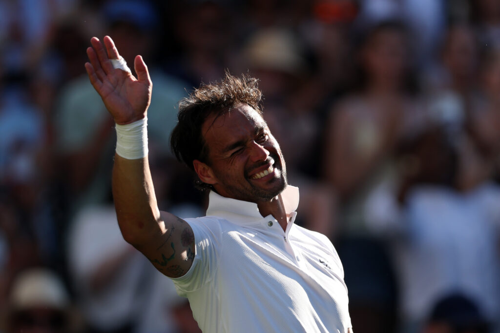 Fabio Fognini waves goodbye after playing the final match of his career.