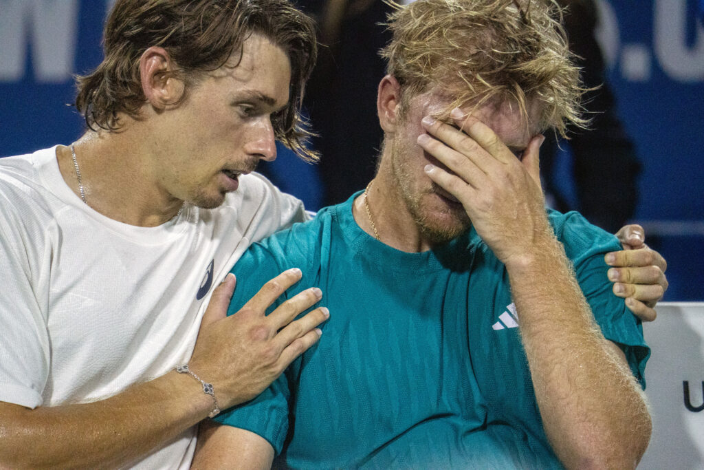 Spain's Alejandro Davidovitch Fokina (right) is comforted by Australia's Alex de Minaur (left) after losing their match during the men's singles final at the Mubadala Citi DC Open at the William H.G. Rock Creek Tennis Center on July 27, 2025 in Washington, DC.