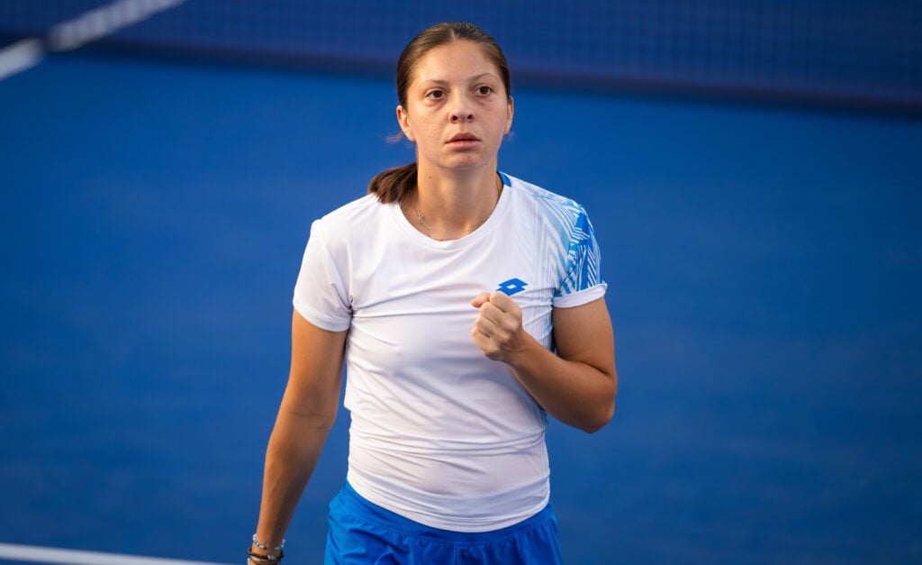 Antonia Ruzic of Croatia in action against Emma Raducanu of Great Britain in the first round on Day Two of the Dubai Duty Free Tennis Championships, part of the Hologic WTA Tour at Dubai Duty Free Tennis Stadium on February 16, 2026 in Dubai, United Arab Emirates