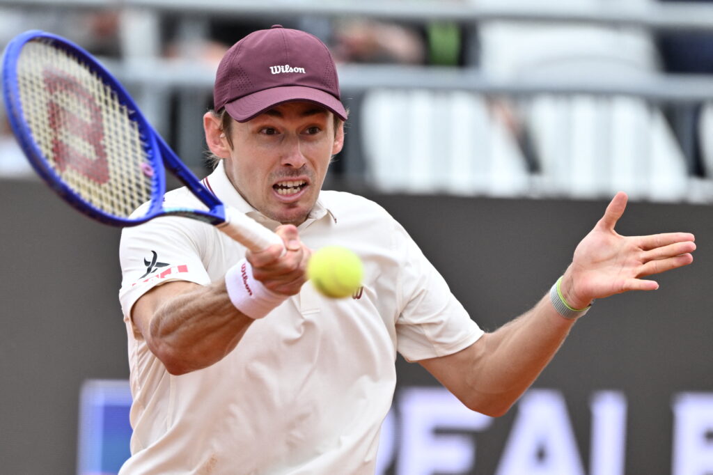 Australia's Alex de Minaur plays a forehand return to Italy's Matteo Arnaldi during their men's singles match of the WTA Rome Open tennis tournament at the Foro Italico in Rome on May 8, 2026.