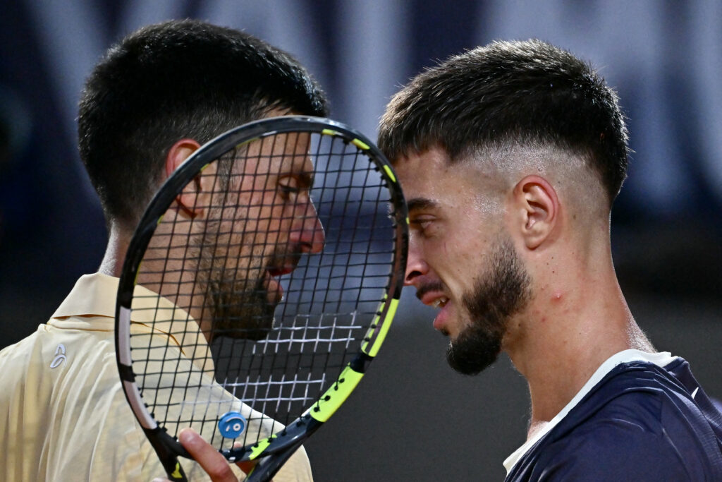 Novak Djokovic and Dino Prizmic embrace after their match in Rome