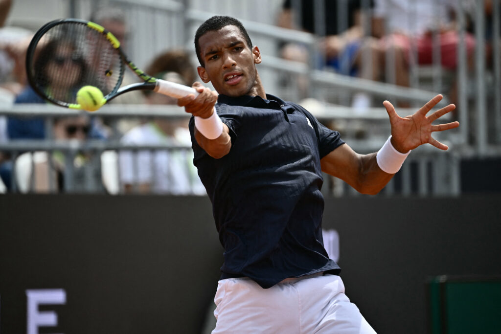 Canada's Felix Auger Aliassime hits a return to Argentine's Mariano Navone during the ATP Rome Open tennis tournament at Foro Italico in Rome on May 9, 2026.